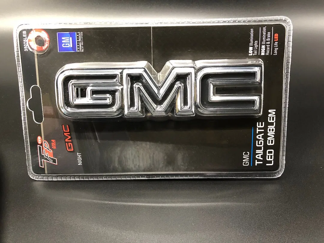 35076LEB – INT TRIM TFP Emblem, LED GMC Logo Tailgate Black Chrome Plated